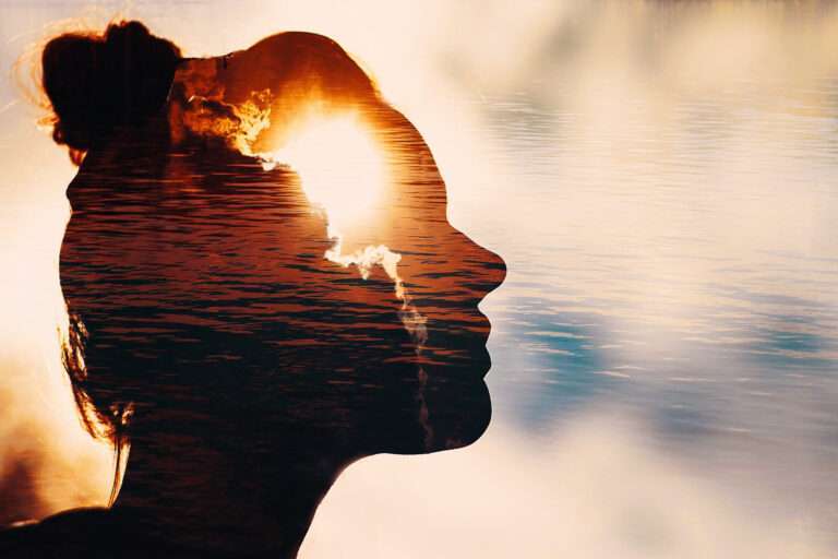 Sun peeks out from behind the clouds in woman’s head